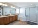Main bathroom with double vanity, bathtub, and shower at 20000 Mitchell Pl # 71, Denver, CO 80249