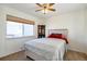Charming bedroom with a queen bed and window at 20000 Mitchell Pl # 71, Denver, CO 80249