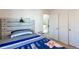 Bedroom with a bed, nightstand, and closet at 20000 Mitchell Pl # 71, Denver, CO 80249