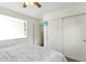 Bedroom with a ceiling fan, double closets and window at 20000 Mitchell Pl # 71, Denver, CO 80249