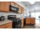 Kitchen with gas range and microwave at 20000 Mitchell Pl # 71, Denver, CO 80249