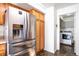Kitchen with stainless steel refrigerator and laundry area at 20000 Mitchell Pl # 71, Denver, CO 80249