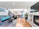 Open living room with hardwood floors and fireplace at 20000 Mitchell Pl # 71, Denver, CO 80249