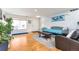 Living room with hardwood floors, couch, and coffee table at 20000 Mitchell Pl # 71, Denver, CO 80249