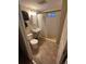 Clean basement bathroom with shower, toilet, and sink at 3120 Ursula St, Aurora, CO 80011