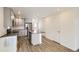 Modern kitchen with gray cabinets, stainless steel appliances, and an island at 10231 E 62Nd Pl, Denver, CO 80238