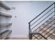 Modern staircase with metal railing and built-in shelving at 1823 Grove St, Denver, CO 80204