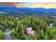 Property's aerial view, highlighting mountain and neighborhood views at 120 Windwood Cir, Breckenridge, CO 80424