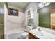 Clean bathroom with white tile and a shower/tub combo at 120 Windwood Cir, Breckenridge, CO 80424