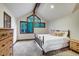 Large bedroom with a king-size bed and wood dresser at 120 Windwood Cir, Breckenridge, CO 80424