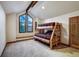 Bedroom with a bunk bed and a large window at 120 Windwood Cir, Breckenridge, CO 80424