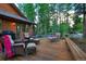 Deck features seating and a view of the surrounding woods at 120 Windwood Cir, Breckenridge, CO 80424