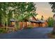 Beautiful home exterior with deck, landscaping, and attached garage at 120 Windwood Cir, Breckenridge, CO 80424