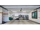 Finished garage with built-in shelving and overhead storage at 120 Windwood Cir, Breckenridge, CO 80424