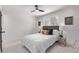 Bright bedroom with ceiling fan and striped bedding at 185 W 9Th Ave, Broomfield, CO 80020