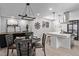 Modern kitchen with white cabinets, a large island, and stainless steel appliances at 185 W 9Th Ave, Broomfield, CO 80020