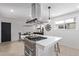 Modern kitchen with stainless steel appliances and an island at 185 W 9Th Ave, Broomfield, CO 80020