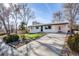 Nice curb appeal with newly painted exterior and well maintained landscaping at 6513 Teller St, Arvada, CO 80003