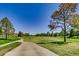 Landscaped golf course with paved pathway at 2896 W Riverwalk Cir # A102, Littleton, CO 80123