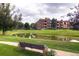 Peaceful pond with building in background at 2896 W Riverwalk Cir # A102, Littleton, CO 80123