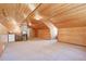 Bonus room with wood walls, kitchenette, and carpet flooring at 7948 S Turkey Creek Rd, Morrison, CO 80465