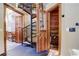 View of a spiral staircase and a wooden storage closet at 7948 S Turkey Creek Rd, Morrison, CO 80465