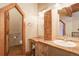 Bathroom with rustic wood vanity and a toilet at 7948 S Turkey Creek Rd, Morrison, CO 80465