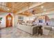 Open living space with stone fireplace and access to kitchen at 7948 S Turkey Creek Rd, Morrison, CO 80465