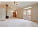 Bright living room with vaulted ceilings, carpet, and wood burning stove at 7948 S Turkey Creek Rd, Morrison, CO 80465