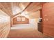 Large bonus room with wood walls and carpet flooring at 7948 S Turkey Creek Rd, Morrison, CO 80465