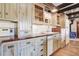 Rustic kitchen with wood cabinets and copper countertops at 7948 S Turkey Creek Rd, Morrison, CO 80465