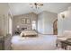 Spacious main bedroom with carpeted floors and access to a balcony at 7948 S Turkey Creek Rd, Morrison, CO 80465