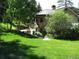 House exterior with stone and stucco, landscaping at 7948 S Turkey Creek Rd, Morrison, CO 80465