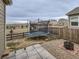 Large backyard with fire pit, trampoline, and patio area at 7203 Arkansas St, Frederick, CO 80530