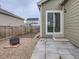 Backyard with patio, fire pit, and access from sliding glass door at 7203 Arkansas St, Frederick, CO 80530