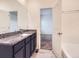Main bathroom features a granite vanity and a separate tub at 7203 Arkansas St, Frederick, CO 80530