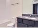 Clean bathroom with granite countertop and a bathtub at 7203 Arkansas St, Frederick, CO 80530