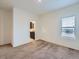 Spacious bedroom with ensuite bathroom access and carpet flooring at 7203 Arkansas St, Frederick, CO 80530