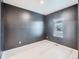 Small bedroom with dark walls, light flooring and a window at 7203 Arkansas St, Frederick, CO 80530