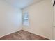 Simple bedroom with neutral walls and carpet flooring at 7203 Arkansas St, Frederick, CO 80530