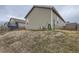 Exterior view of house showing backyard and landscaping at 7203 Arkansas St, Frederick, CO 80530