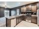 Modern kitchen features stainless steel appliances and granite countertops at 7203 Arkansas St, Frederick, CO 80530