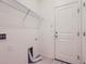 Bright laundry room with shelving and built-in storage at 7203 Arkansas St, Frederick, CO 80530