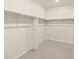 Spacious walk-in closet with double hanging rods at 9110 Pitkin St, Commerce City, CO 80022