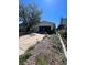 Attached garage with driveway and landscaping at 18064 E Ford Pl, Aurora, CO 80017