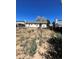 Large backyard with a mostly empty lot at 18064 E Ford Pl, Aurora, CO 80017