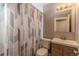 Clean bathroom with updated vanity and shower/tub combo at 5402 E 60Th Way, Commerce City, CO 80022