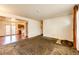 Spacious living room with view into kitchen and dining area at 6584 Kline St, Arvada, CO 80004