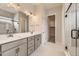 Elegant bathroom with double vanity, walk-in shower, and separate toilet area at 1871 Grayside Cir, Castle Rock, CO 80109