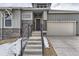 Front entrance with modern steps and stone accents at 1871 Grayside Cir, Castle Rock, CO 80109